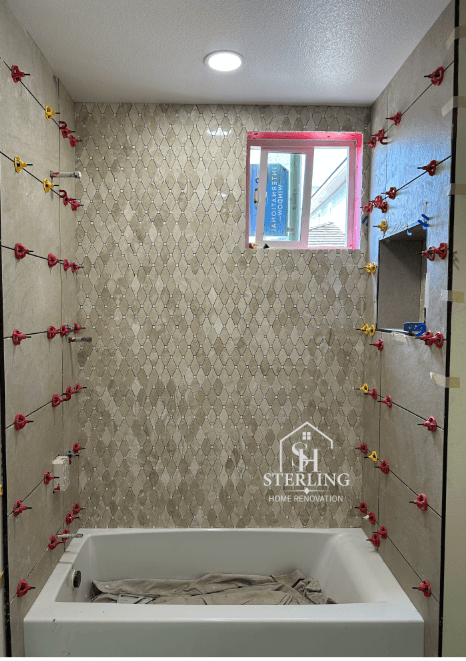 Bathroom tile installation in progress