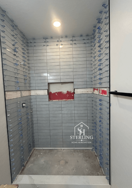 Bathroom tile installation in progress